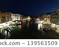 A night view of the Grand Canal from the Rialto Bridge in the old town of Venice, Italy. 139563509