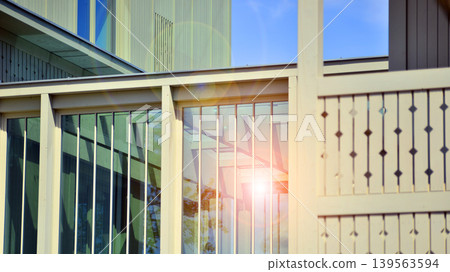 A fragment of a low-rise office building in the classical style. Modernity and tradition in office architecture. A fragment of a low-rise office building in the classical style. Modernity and tradition in office architecture. 139563594