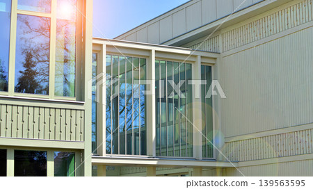 A fragment of a low-rise office building in the classical style. Modernity and tradition in office architecture. A fragment of a low-rise office building in the classical style. Modernity and tradition in office architecture. 139563595