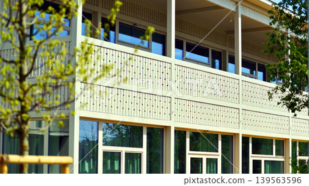A fragment of a low-rise office building in the classical style. Modernity and tradition in office architecture. A fragment of a low-rise office building in the classical style. Modernity and tradition in office architecture. 139563596