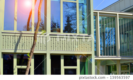 A fragment of a low-rise office building in the classical style. Modernity and tradition in office architecture. A fragment of a low-rise office building in the classical style. Modernity and tradition in office architecture. 139563597