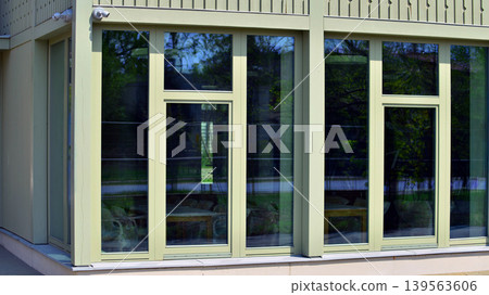 A fragment of a low-rise office building in the classical style. Modernity and tradition in office architecture. 139563606