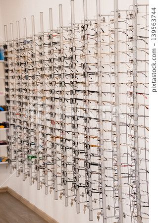 Glasses Display Rack Wall Eyewear Collection Retail Store Optical Shop Interior Minimalist Design White Background Modern Layout Glasses Display Rack Wall Eyewear Collection Retail Store Optical Shop Interior Minimalist Design White Background Modern Layout 139563744