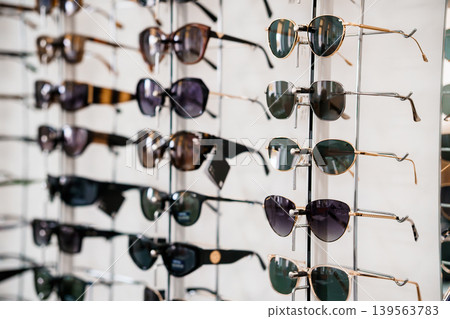 Sunglasses display rack with eyewear collection for retail shop store window sale fashion glasses accessories optical equipment 139563783
