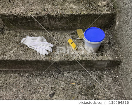 Painting Tools and Glove on Concrete Steps Painting Tools and Glove on Concrete Steps 139564216
