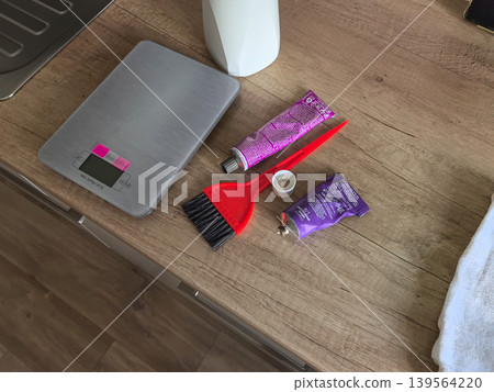 Professional Hair Dye Mixing Supplies on Wooden Counter Professional Hair Dye Mixing Supplies on Wooden Counter 139564220