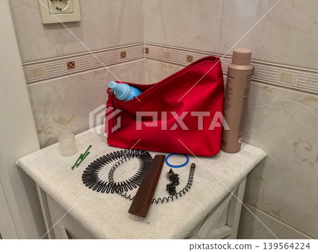 Red Cosmetic Bag with Hair Care Accessories and Dry Shampoo Red Cosmetic Bag with Hair Care Accessories and Dry Shampoo 139564224