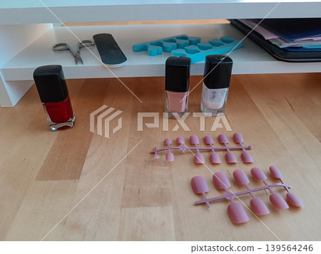 Nail care products and manicure tools on wooden table 139564246