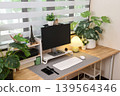 Modern contemporary home office setup with wooden desk surrounded by green plant 139564346