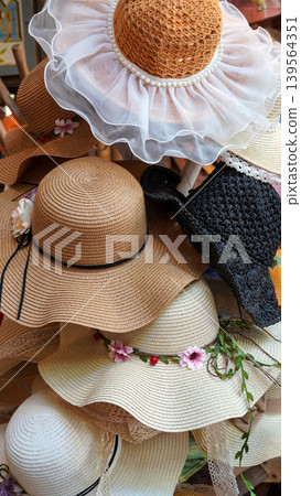 Beautiful collection of various women straw sun hats Beautiful collection of various women straw sun hats 139564351