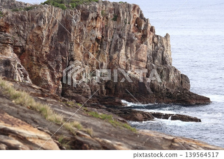 Three-tiered cliffs on the coast Three-tiered cliffs on the coast 139564517