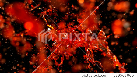 Red liquid splash isolated on black background resembling blood or red wine with realistic droplets for VFX overlay and cinematic visual effects Red liquid splash isolated on black background resembling blood or red wine with realistic droplets for VFX overlay and cinematic visual effects 139565069