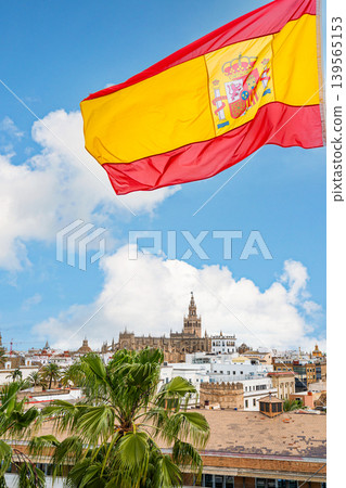 Spanish Flag Over Seville Skyline With Cathedral And Giralda Spanish Flag Over Seville Skyline With Cathedral And Giralda 139565153