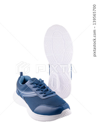 blue sneaker and white sole close up on white background blue sneaker and white sole close up on white background 139565700