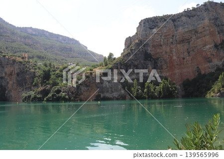 Turquoise Waters of Cortes de Pallas Reservoir and Limestone Cliffs in Valencia, Spain 139565996