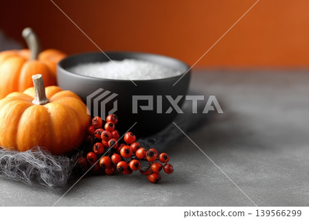 Seasonal decor features pumpkins and vibrant red berries 139566299