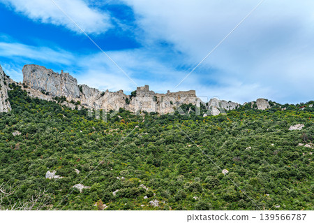 The Cathar medieval castle of Peyrepertuse in the Aude department, southern France situated in the French Pyrenees The Cathar medieval castle of Peyrepertuse in the Aude department, southern France situated in the French Pyrenees 139566787
