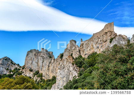 The Cathar medieval castle of Peyrepertuse in the Aude department, southern France situated in the French Pyrenees The Cathar medieval castle of Peyrepertuse in the Aude department, southern France situated in the French Pyrenees 139566788