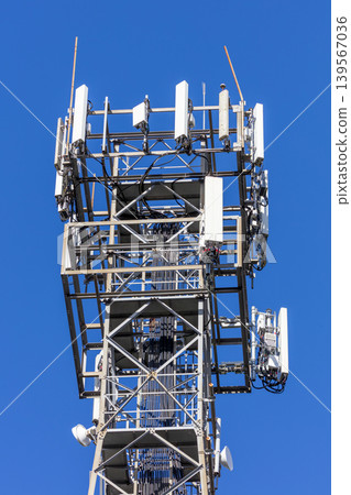 The top section of a large and high telecommunications tower 139567036