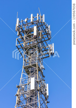 The top section of a large and high telecommunications tower 139567038