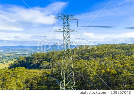 A large electrical transmission tower in a valley in the Blue Mountains A large electrical transmission tower in a valley in the Blue Mountains 139567048