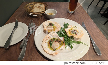 Grilled scallops with arugula on a plate Grilled scallops with arugula on a plate 139567295