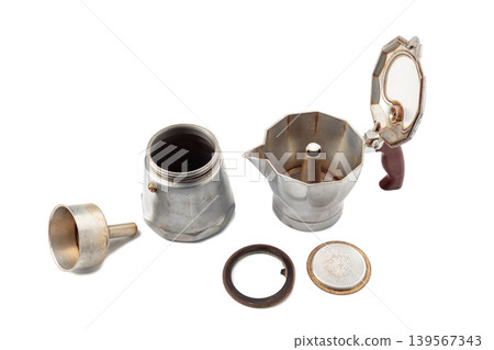 A classic Italian aluminium moka pot isolated on a white background. A classic Italian aluminium moka pot isolated on a white background. 139567343