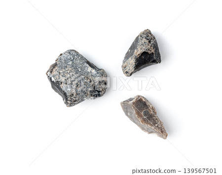 Natural black flint, chert mineral isolated Natural black flint, chert mineral isolated 139567501