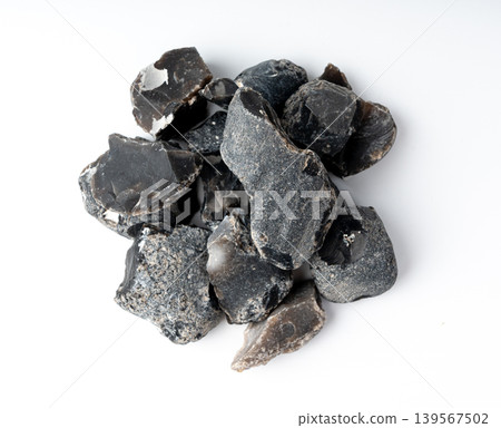 Natural black flint, chert mineral isolated Natural black flint, chert mineral isolated 139567502