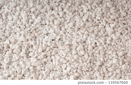 Perlite textured background, crushed amorphous volcanic glass close up Perlite textured background, crushed amorphous volcanic glass close up 139567600