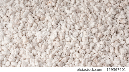 Perlite textured background, crushed amorphous volcanic glass close up Perlite textured background, crushed amorphous volcanic glass close up 139567601