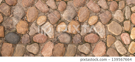 Brown Old Stone Pavement Top View or Granite Cobblestone Road Brown Old Stone Pavement Top View or Granite Cobblestone Road 139567664