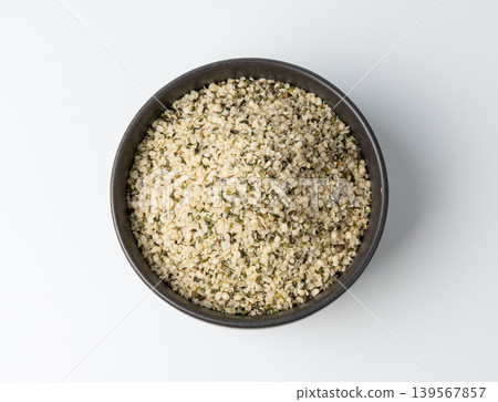 Shelled hemp seeds pile isolated, peeled cannabis grains, marijuana kernels without peel Shelled hemp seeds pile isolated, peeled cannabis grains, marijuana kernels without peel 139567857