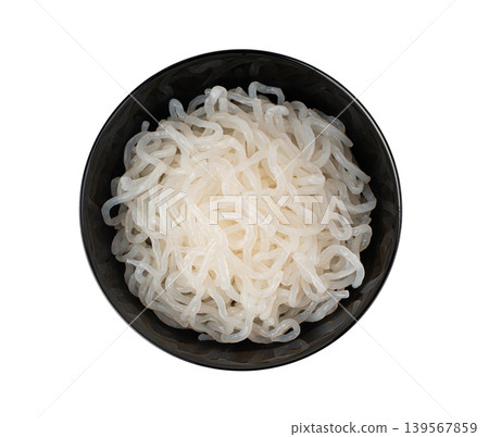 Shirataki or konnyaku pasta in black bowl isolated. Konjak jelly noodles, Japanese zero calorie sirataki 139567859