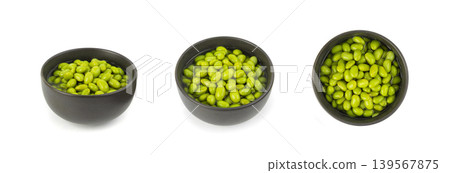 Edamame beans isolated. Green soy bean pile, cooked young soybean, boiled Japanese pea Edamame beans isolated. Green soy bean pile, cooked young soybean, boiled Japanese pea 139567875