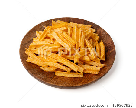 Fried chips sticks isolated, finger potato chips, golden shoestring fries pile, French fries Fried chips sticks isolated, finger potato chips, golden shoestring fries pile, French fries 139567923