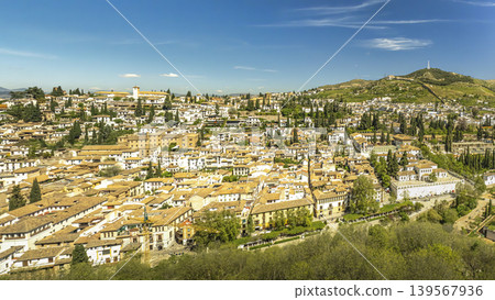 Panoramic View of Historic Granada Neighborhood on Sunlit Hillside in Andalusia 139567936