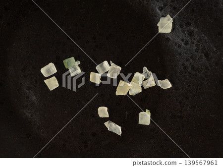 Candied citrus peel isolated. Diced succade from the citron or citrus medica Candied citrus peel isolated. Diced succade from the citron or citrus medica 139567961