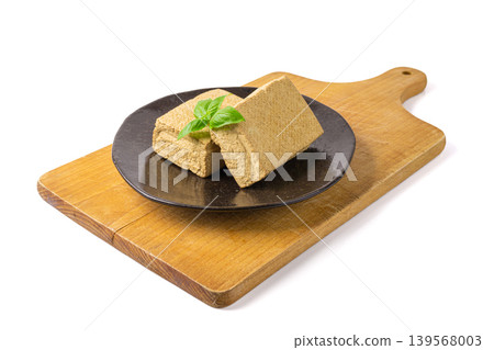 Tofu Cheese Isolated, Smoked Vegan Cheese Slice, Sliced Soya Bean Curd, Soy Protein or TSP Tofu Cheese Isolated, Smoked Vegan Cheese Slice, Sliced Soya Bean Curd, Soy Protein or TSP 139568003