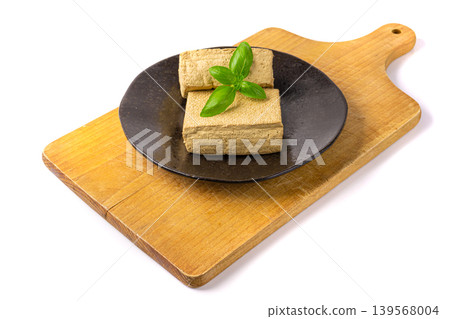 Tofu Cheese Isolated, Smoked Vegan Cheese Slice, Sliced Soya Bean Curd, Soy Protein or TSP Tofu Cheese Isolated, Smoked Vegan Cheese Slice, Sliced Soya Bean Curd, Soy Protein or TSP 139568004