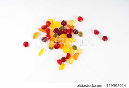 Fruit gummy candy pile isolated, vegan chewing marmalade pills, jelly gumdrops heap Fruit gummy candy pile isolated, vegan chewing marmalade pills, jelly gumdrops heap 139568024