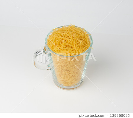 Raw vermicelli, gold soup pasta, small scattered homemade noodles, thin macaroni Raw vermicelli, gold soup pasta, small scattered homemade noodles, thin macaroni 139568035