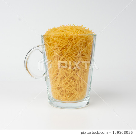 Raw vermicelli, gold soup pasta, small scattered homemade noodles, thin macaroni Raw vermicelli, gold soup pasta, small scattered homemade noodles, thin macaroni 139568036