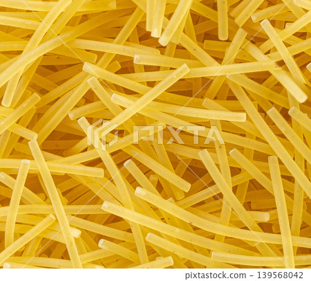Raw vermicelli macro pattern, gold soup pasta Raw vermicelli macro pattern, gold soup pasta 139568042