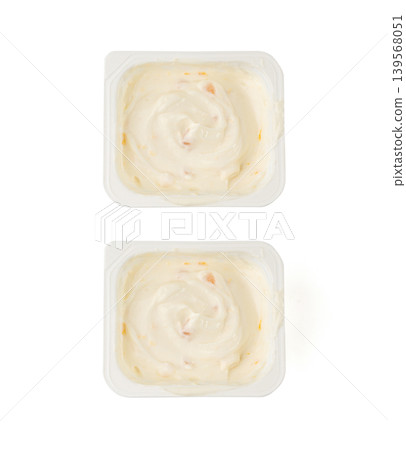 Yogurt cup isolated, yoghurt with orange fruits pieces in plastic pot, milk pudding container Yogurt cup isolated, yoghurt with orange fruits pieces in plastic pot, milk pudding container 139568051