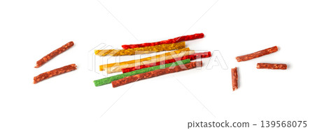 Rawhide chew sticks for dogs, colorful collagen dog food, pressed dry kibble, dental care treats 139568075