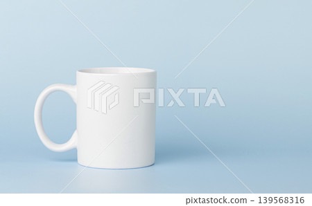 white cup for tea or coffee on a blue background white cup for tea or coffee on a blue background 139568316