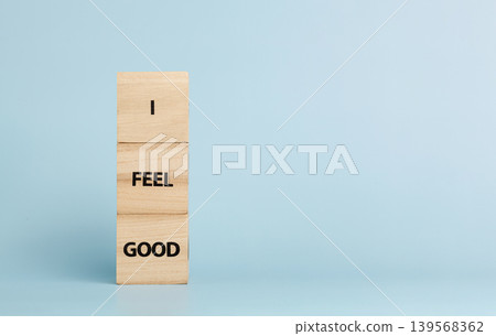 Wooden cubes with inscriptions I Feel Good on a blue background Wooden cubes with inscriptions I Feel Good on a blue background 139568362