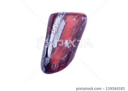 Bull eye mineral stone, tiger's eye in the breed on a white background 139568385