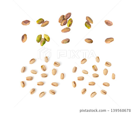 Fried salt pistachio nuts isolated. Baked pistachios pile, roasted green pistache fruit in shell on white 139568678